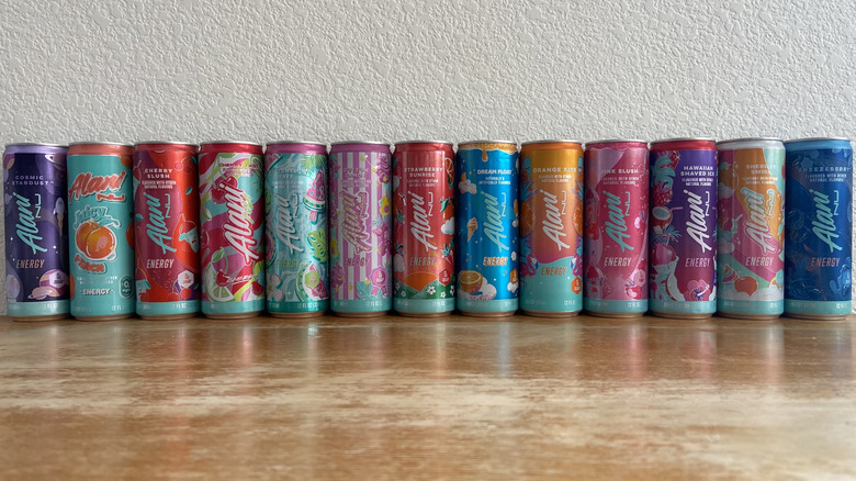 All Alani Nu cans lined up in a horizontal row