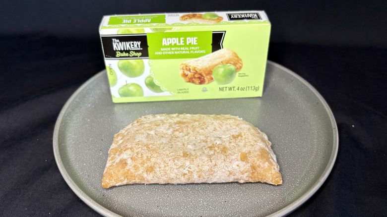 Kwik Trip apple pie on a plate in front of the box