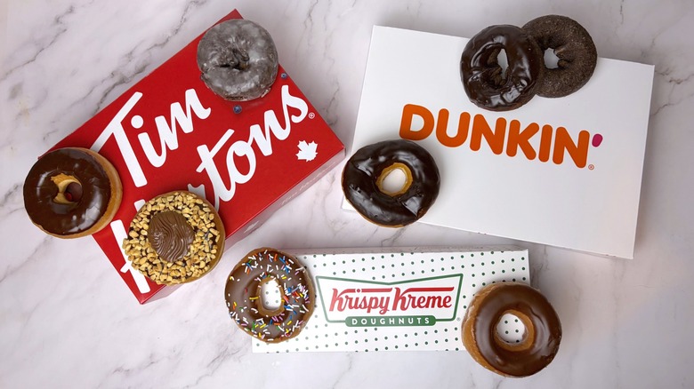 A variety of chocolate donuts from Tim Hortons, Dunkin', and Krispy Kreme