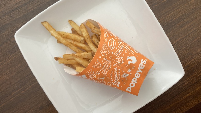 cup of Popeyes Cajun seasoned fries