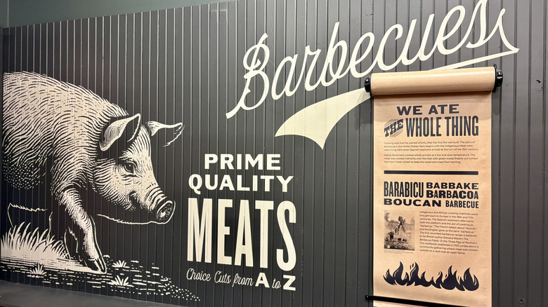 a pig painted on a wall under the word Barbecues