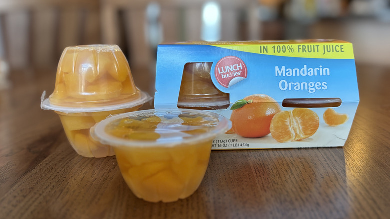 fruit cups in packaging and on table