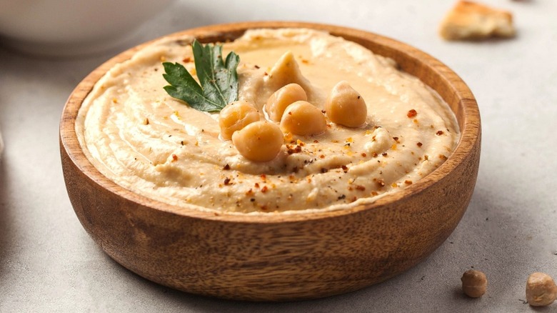 Bowl of hummus topped with chickpeas 