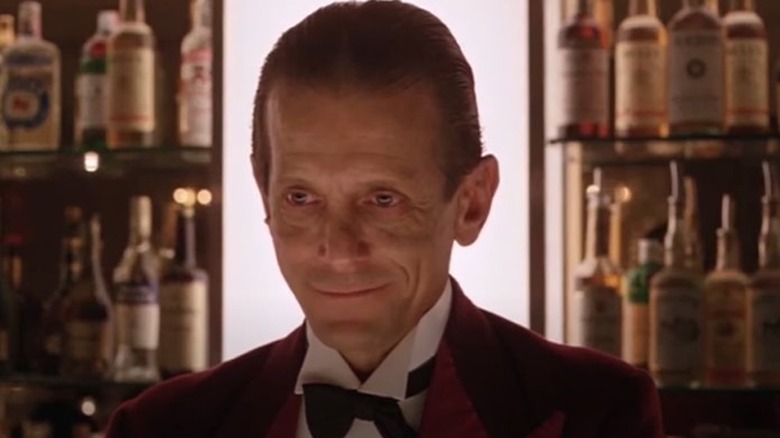 Lloyd the bartender smirking