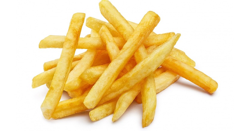 Pile of fries on white background
