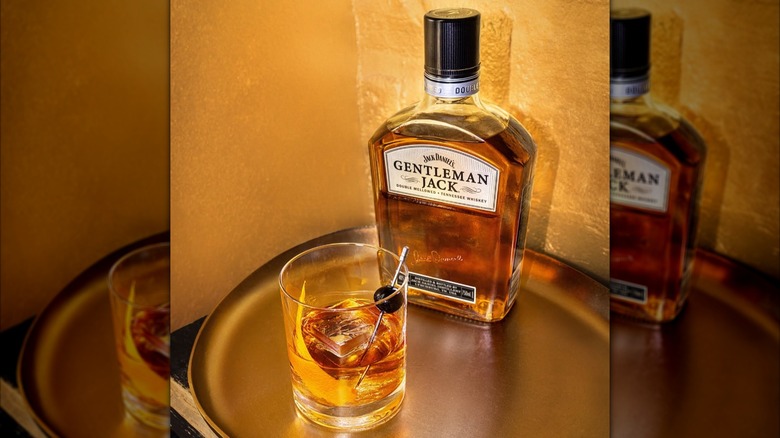 Bottle of Gentleman Jack with cocktail on tray