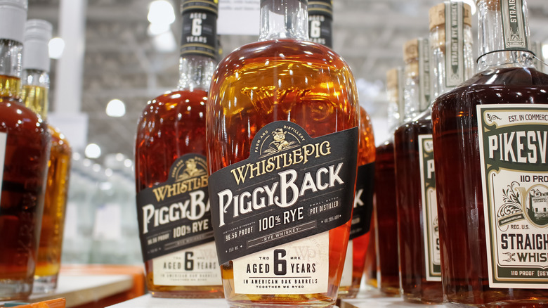 Bottles of WhistlePig PiggyBack Bourbon on shelf