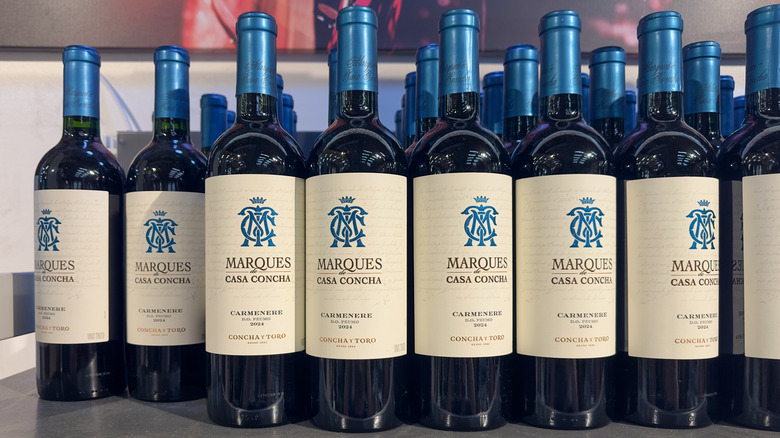 Bottles of Marques Casa Concha carménère on a shelf.