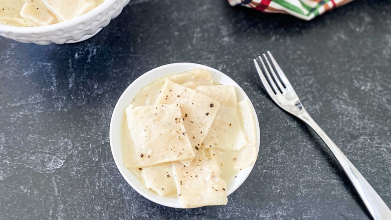 square dumplings in white bowl