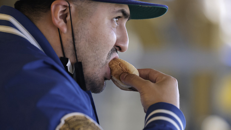 Dodgers fan eating hot dog 