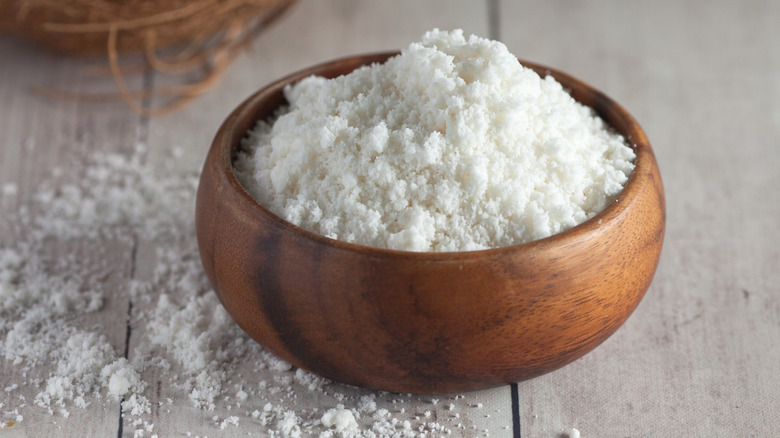 Powdered coconut milk in a wooden bowl