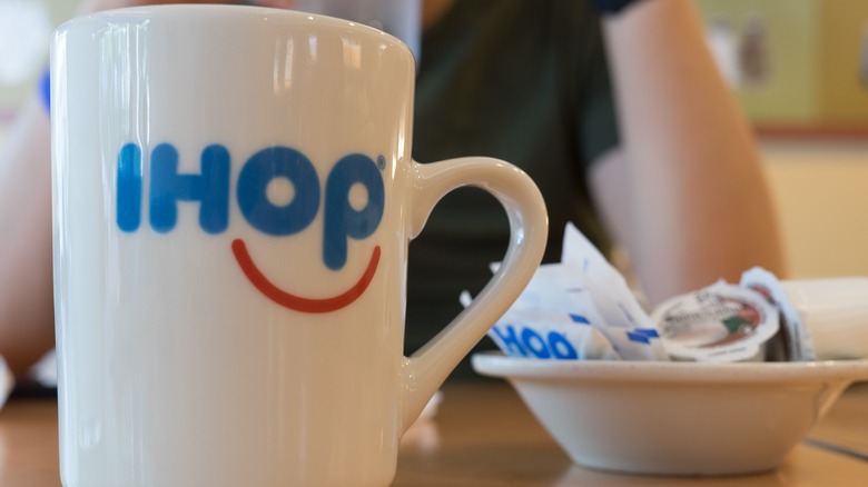 IHOP mug, dish of creamer and sugar packets