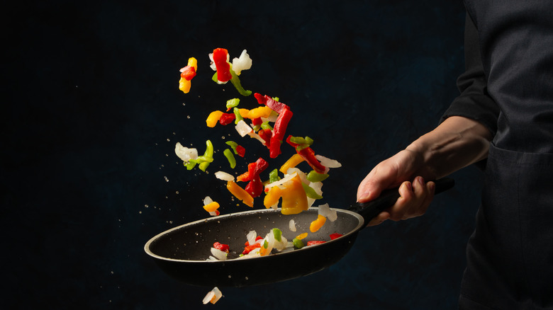 Vegetables tossed by a chef