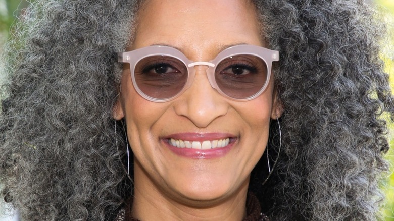 Carla Hall with sunglasses and wide smile