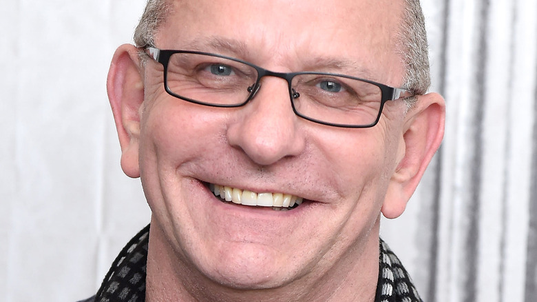 Robert Irvine smiling with glasses