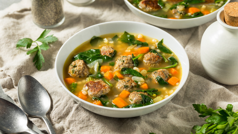 Italian wedding soup in white bowls