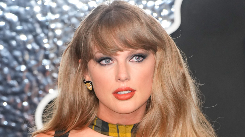 Taylor Swift in plaid at a red carpet event