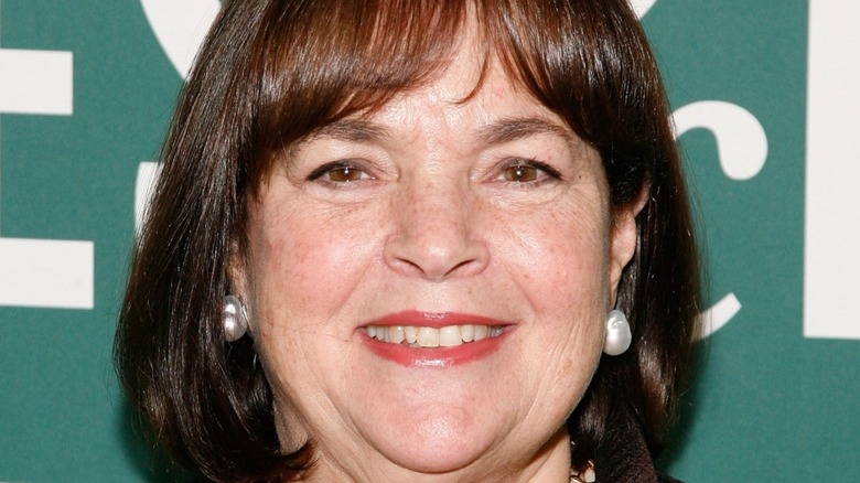 Head shot of Ina Garten smiling with red lipstick