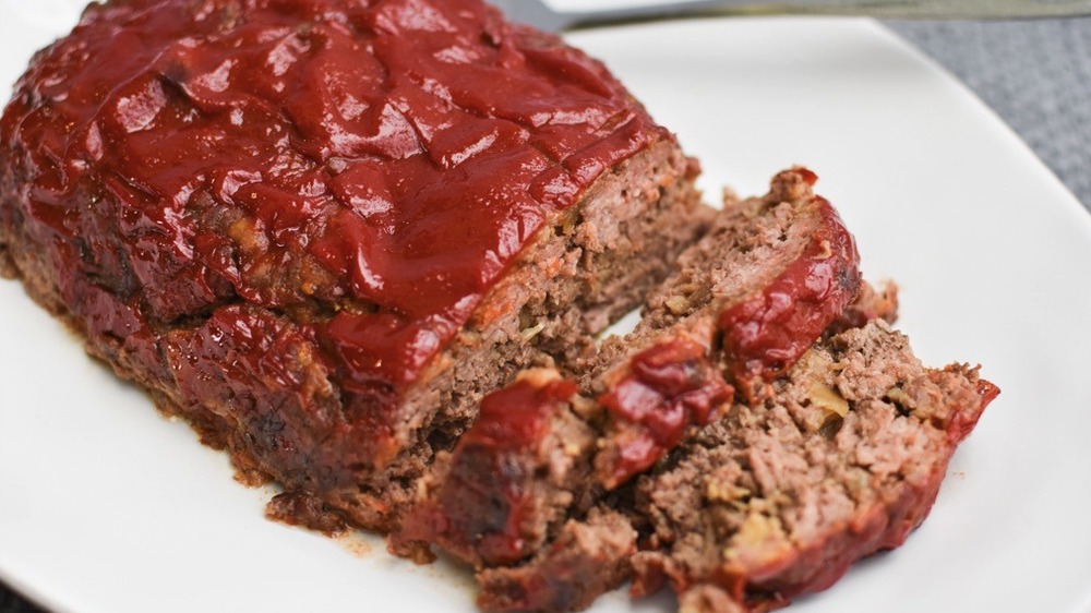 sliced meatloaf with ketchup