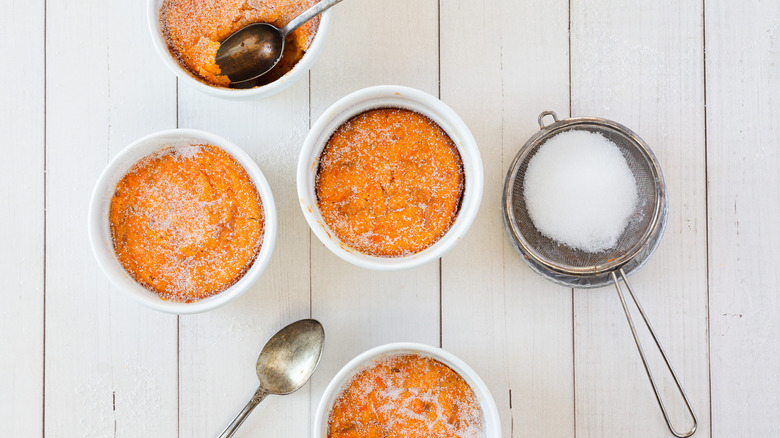 four carrot soufflés in ramekins