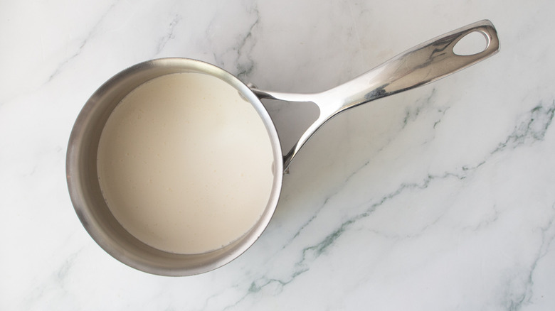 white liquid in a metal pot