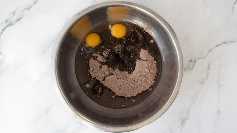 brownie batter ingredients in a metal bowl
