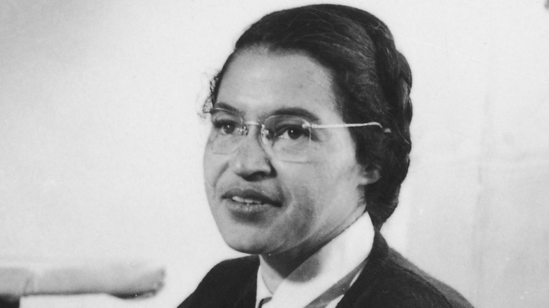 Rosa Parks working as a seamstress in a black and white photo