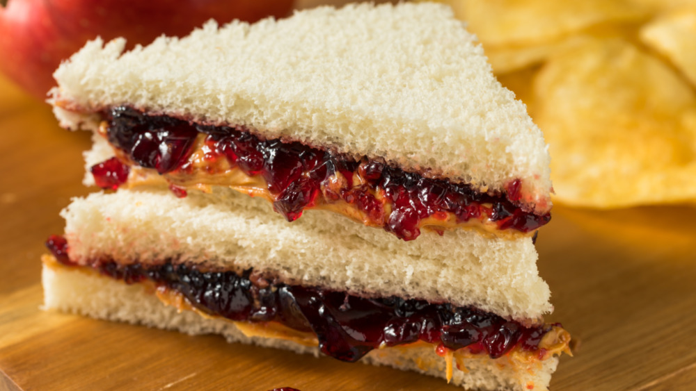 peanut butter and jelly sandwich cut in triangles with white bread