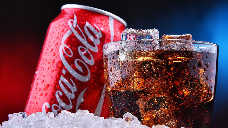 Coca-cola in glass with can 