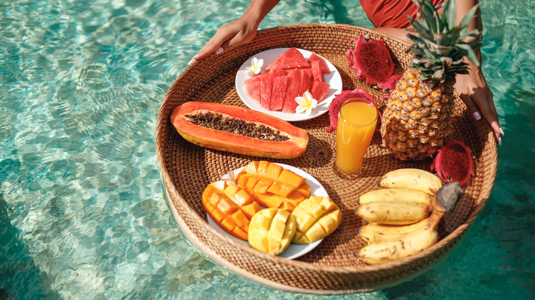 Fruit on tray in pool