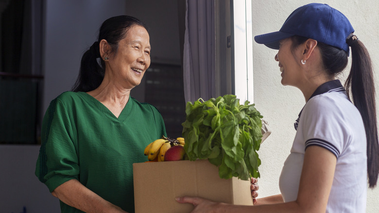 Woman delivers groceries