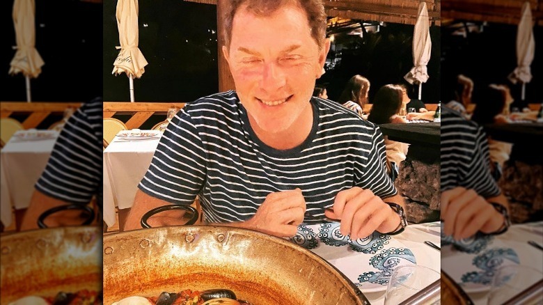 Bobby Flay smiling at restaurant