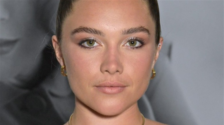 Closeup of Florence Pugh wearing earrings