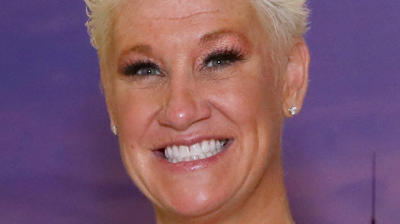 Anne Burrell smiling at an event