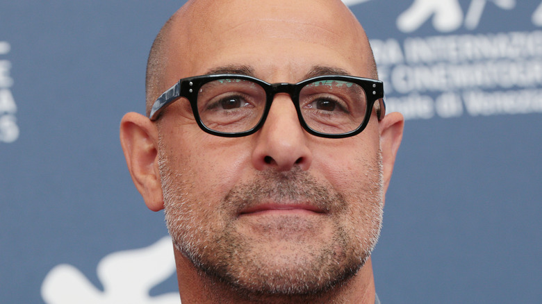 Close up of Stanley Tucci wearing glasses