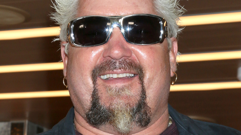 Guy Fieri sunglasses and earrings