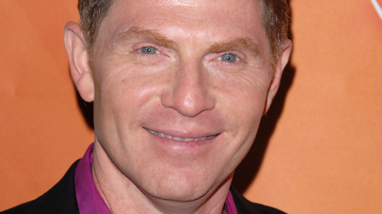 Celebrity chef Bobby Flay on orange background