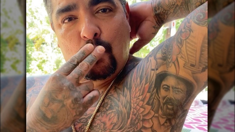 Aaron Sánchez displaying armpit tattoo