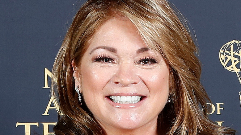 Valerie Bertinelli holding Emmys