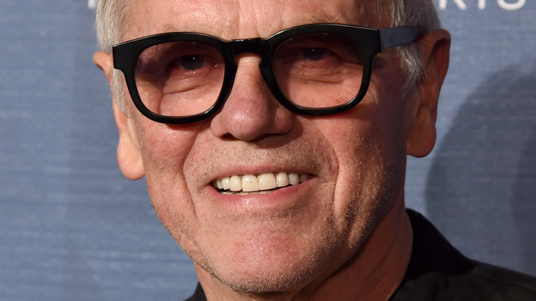 Wolfgang Puck in black glasses