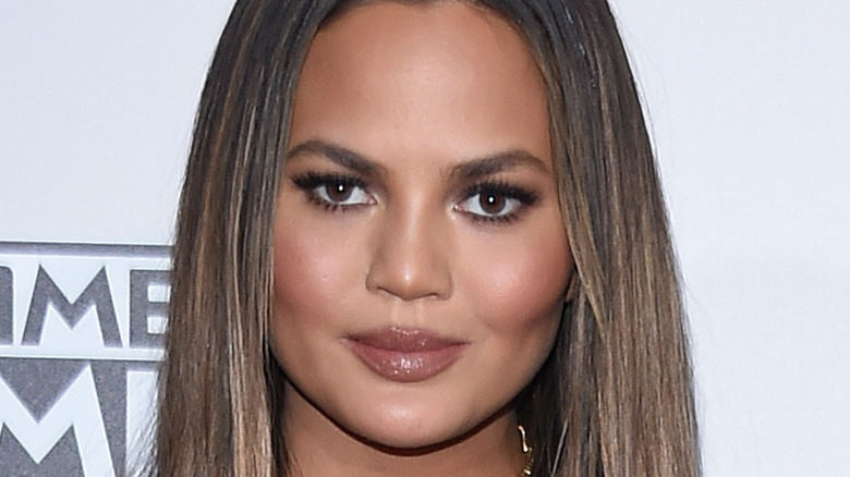 chrissy teigen smirking