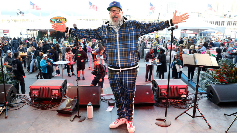 Andrew Zimmern wearing blue plaid