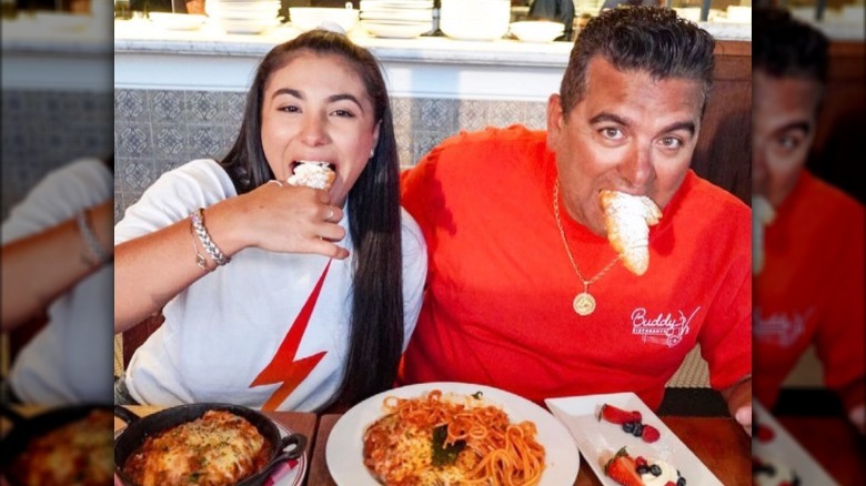 Sofia and Buddy Valastro with food in their mouths