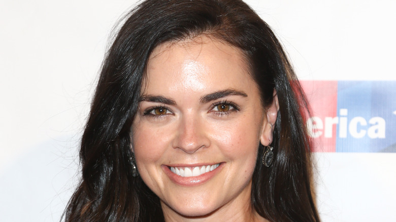 Close-up of Katie Lee Biegel wearing blue earrings