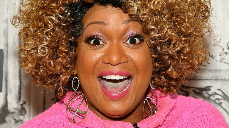 Sunny Anderson smiling with mouth open