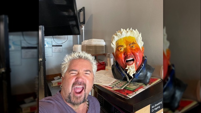 Guy Fieri with a bust