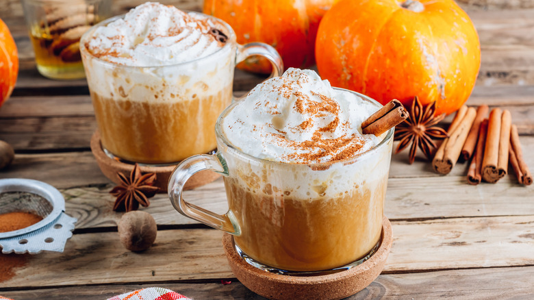 Two pumpkin spice lattes topped with whipped cream