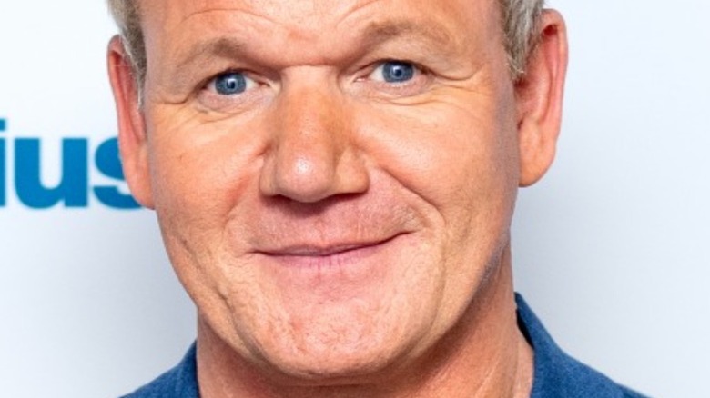 Gordon Ramsay with slight smile on the red carpet