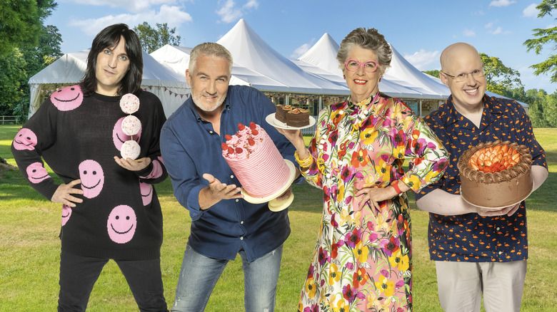 Great British Bake Off hosts in cast photo