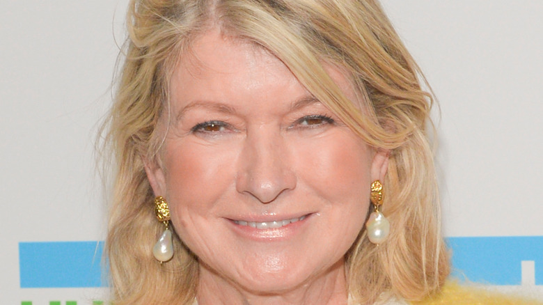 Martha Stewart smiles with pearl earrings